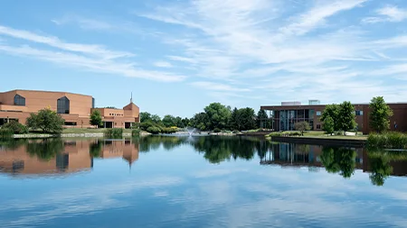Campus buildings and lake.