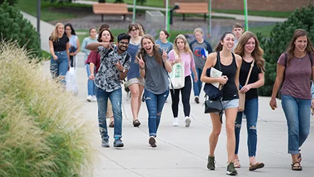 Group of students walking to chapel.