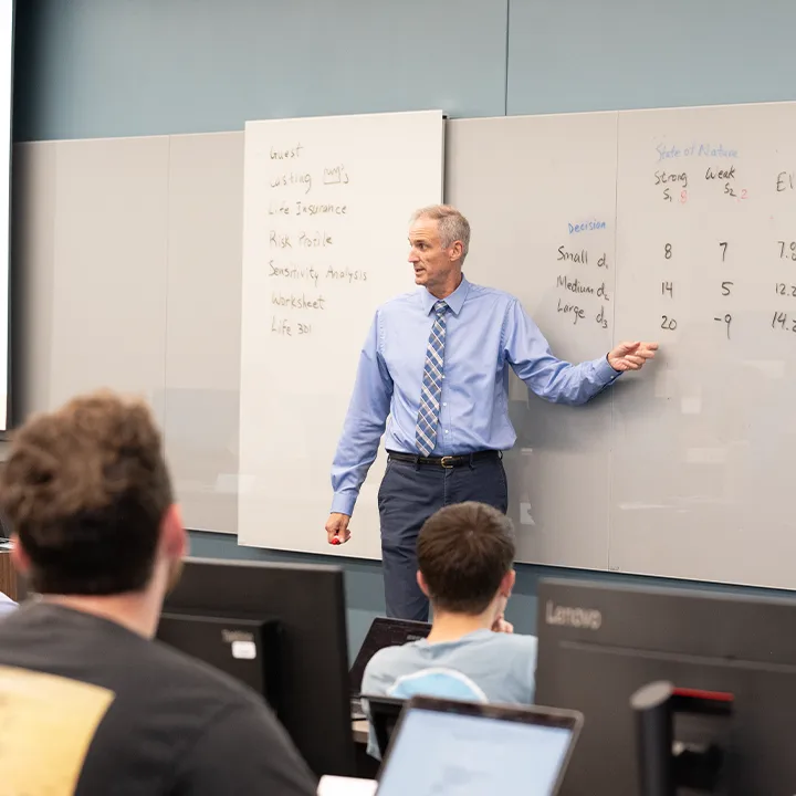 Professor teaching in a classroom.