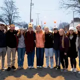 friendshangingoutindowntownCedarvilleduringLittleTownofLights2025