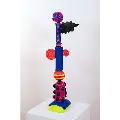 Vibrant, whimsical sculpture composed of colorful spirals, spheres, and cylinders.