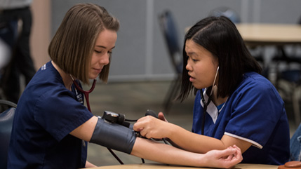 Cedarville nursing student takes blood pressure reading