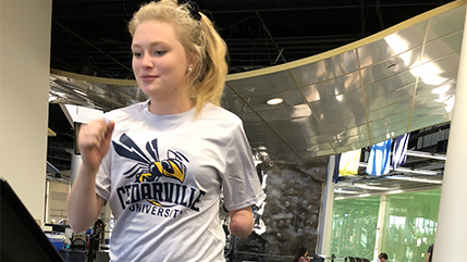 Cedarville University junior Mallory Waayenberg, who has a prosthetic arm, is getting assistance from Cedarville engineering majors developing a 3D attachment that will help her lift weights. 