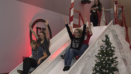 Students glide down giant slides during Cedarville's Campus Christmas