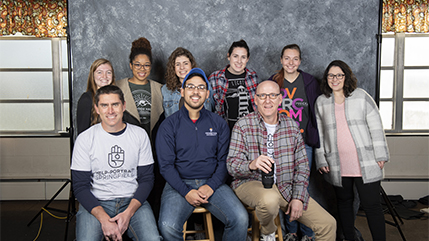 Cedarville University photographer Scott Huck, front row, far right, along with staff and student helpers working at Help Portrait. 