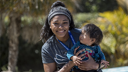 Cedarville University nursing student holding a Honduran baby. 