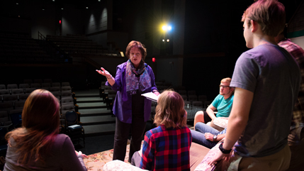 Dr. Diane Merchant speaking with student actors.