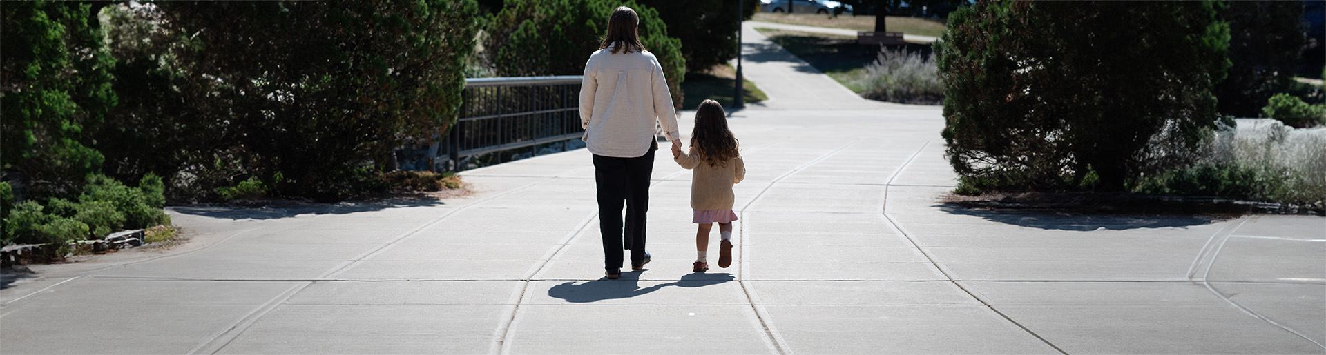 Alyson Punzi walking with daughter on campus of CU 1920