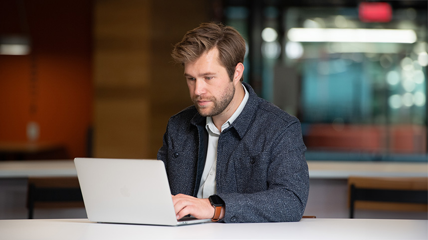 Graduates student at Cedarville University studies at his laptop.