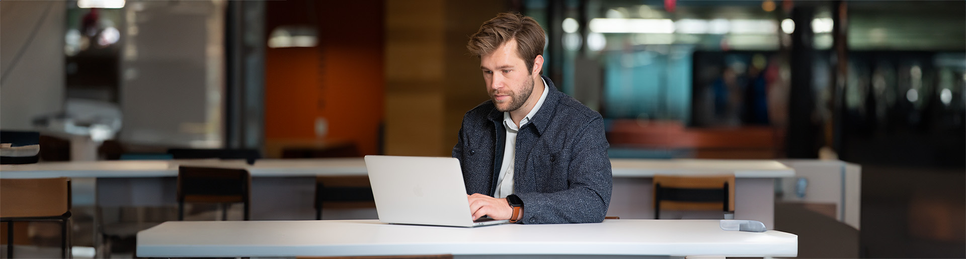 Graduates student at Cedarville University studies at his laptop.