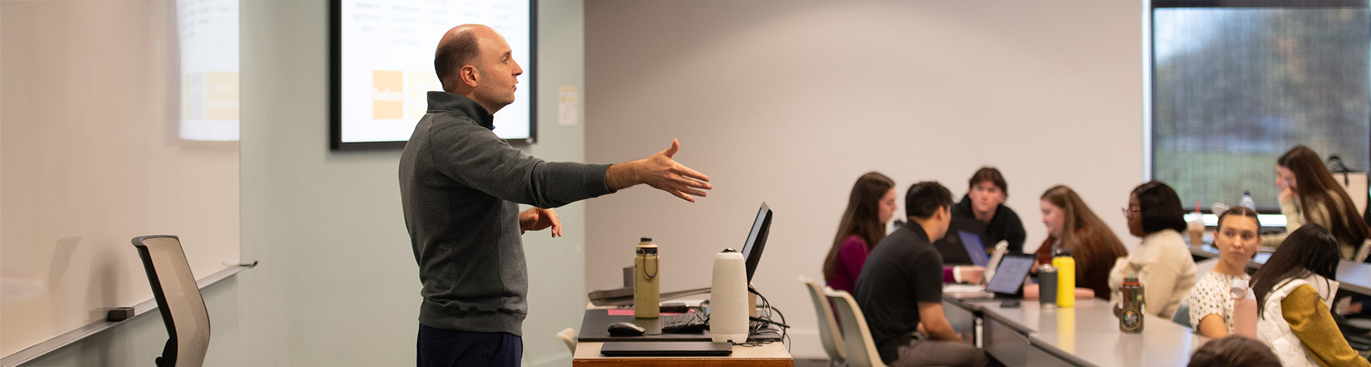 Professor Justin Cole teaches professional ethics to a joint class of pharmacy and physician assistant students