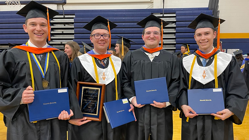 Leadership team for Midian Prime – from left to right: Lucas Mattocks, Willem Vandermeij, Matthew Brugel, Krestian Robe in cap and gown as they celebrate graduating from Cedarville University