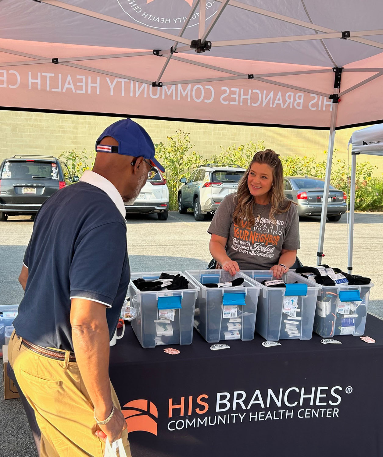 Melissa VanHeukelum works at an outreach table for His Branches, a clinic in Rochester, New York