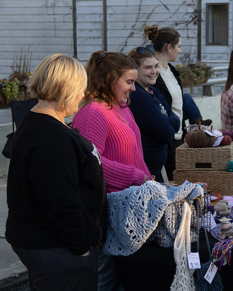 Molly Goodman sells products made by her business, Handmade Goods, at Cedarville's Sidewalk Saturday.