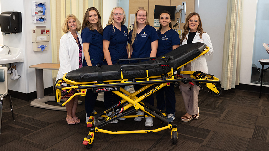 Nursing faculty and students with new Stryker Stretcher 858