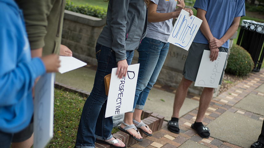 Cedarville students with hope and perspective signs 858