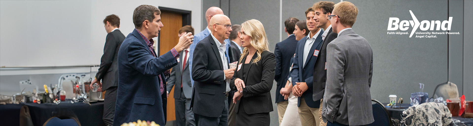 Dr. Haymond interacts with students and guests at a Beyond Angels event.