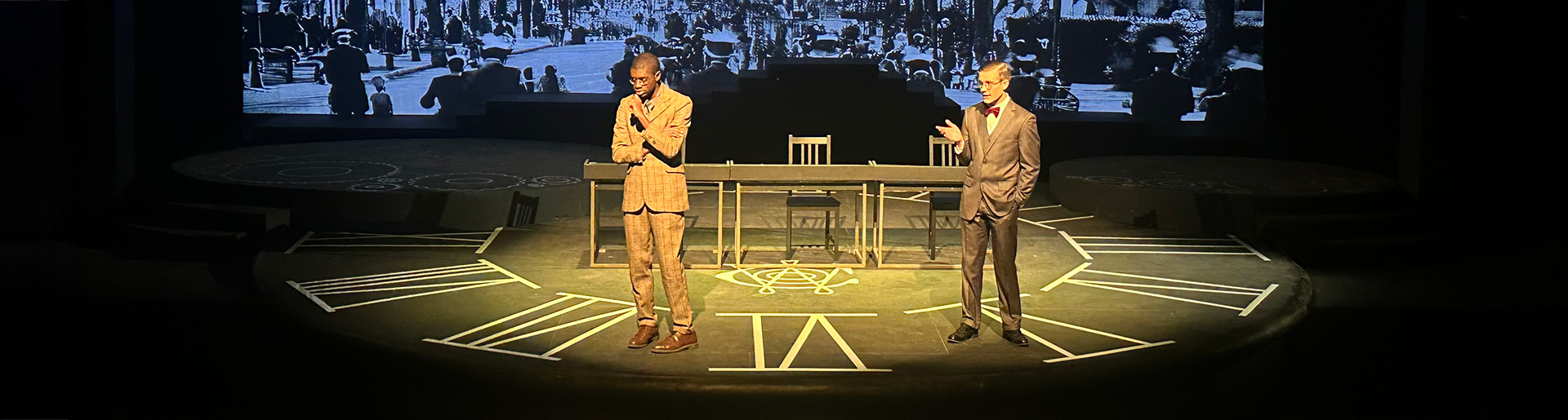 Isaac Ajayi and Peter Larson acting onstage in &quot;Radium Girls.&quot;