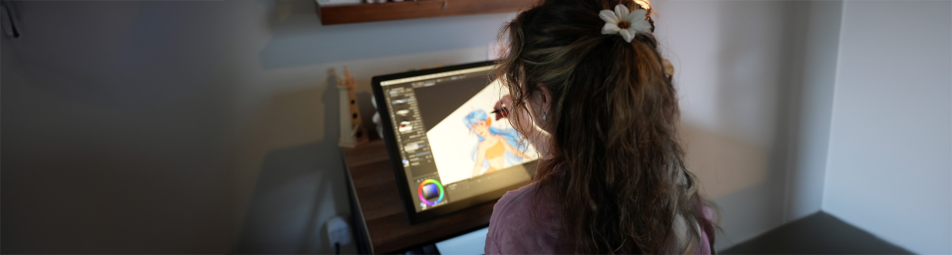 Aria Joy Prichard digitally illustrates one of her designs.