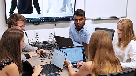 A group of IBC students working together