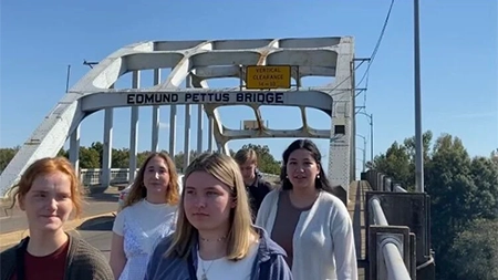 Group of students walking on Edmund Pettus Bridge.