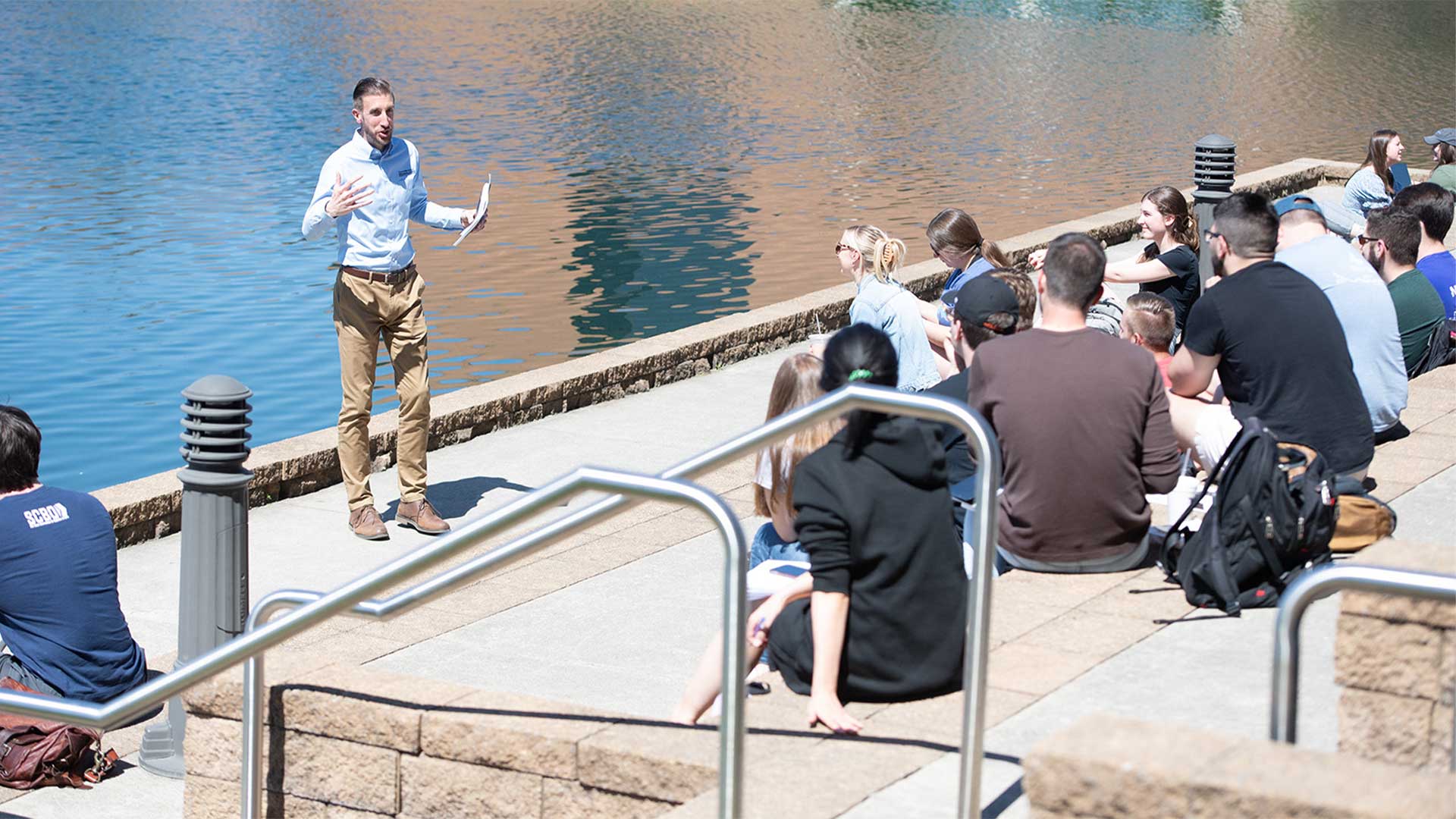 Jeremy Kimble teaching class on BTS steps on a sunny day.