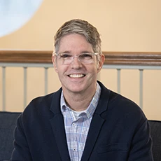 Matt Otto smiling and holding Bible